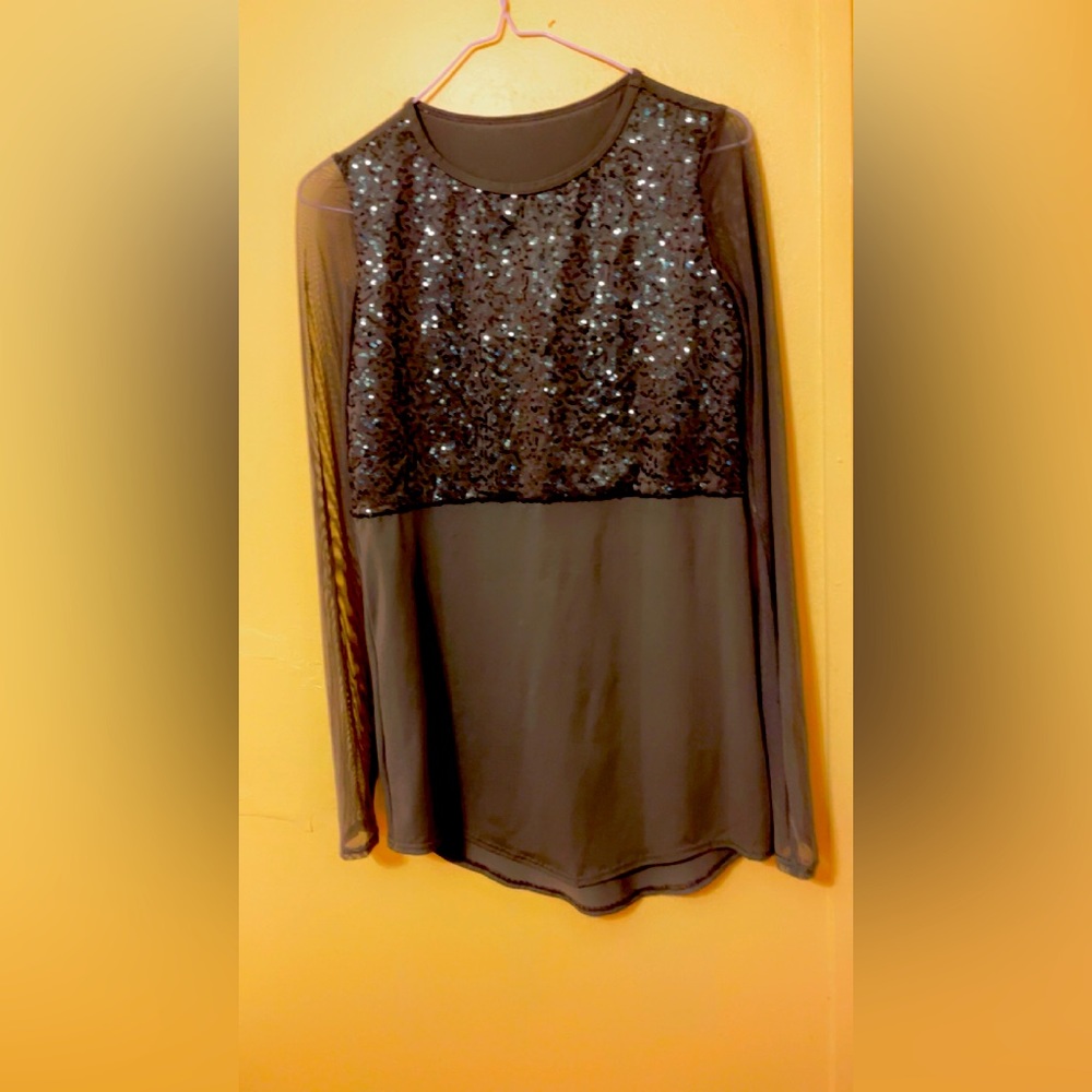 A green and black dance costume. Comes with a top and leggings